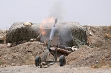 Fighters of the Syria Democratic Forces fire a mortar shell towards positions held by Islamic State fighters in northern province of Raqqa, Syria May 27, 2016. PHOTO BY REUTERS/Rodi Said