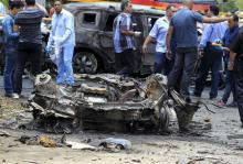 Crime scene investigators investigate the site of a car bomb attack on the convoy of Egyptian public prosecutor Hisham Barakat near his house at Heliopolis district in Cairo, Egypt, June 29, 2015. PHOTO BY REUTERS/Mohamed Abd El Ghany