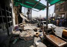 Damaged shops are seen at the site of car bomb attack near a government office in Karkh district in Baghdad, Iraq, May 30, 2017. PHOTO BY REUTERS/Khalid al-Mousily