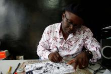 Thembo Kashauri, Democratic Republic of Congo's best-known political cartoonist is seen during an interview with Reuters in Kinshasa, Democratic Republic of Congo, December 26, 2018. PHOTO BY REUTERS/Baz Ratner