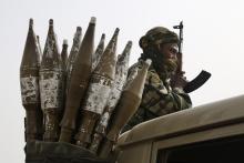 A Chadian soldier rides atop a pickup truck next to a bag of rocket-propelled grenades in Gambaru, Nigeria, February 26, 2015. PHOTO BY REUTERS/Emmanuel Braun