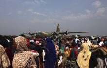 Chadian people crowd at the airport while waiting to be evacuated back to their country, in Bangui