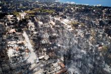 An aerial view shows burnt houses and trees following a wildfire in the village of Mati, near Athens, Greece, July 25, 2018. PHOTO BY REUTERS/Antonis Nicolopoulos/Eurokinissi