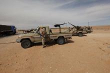 Libyan military vehicles are pictured at a checkpoint in Wadi Bey, west of the Islamic State-held city of Sirte, February 23, 2016. PHOTO BY REUTERS/Ismail Zitouny