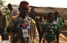 An Anti-balaka child soldier wears lucky charms around his neck while he poses for a picture in Ouengo district, 7th arrondissement in Bangui, in a file photo. PHOTO BY REUTERS/Emmanuel Braun