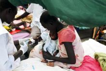 A medical staff attends to a malnourished child at a Medecins Sans Frontieres (MSF) hospital in an internally displaced persons (IDP) camp inside the U.N. base in Malakal, July 24, 2014. PHOTO BY REUTERS/Andreea Campeanu