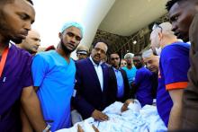 Somalia's President Mohamed Abdullahi Mohamed visits a child injured in the car bomb explosion at the Afgoye junction, who waits to be transported on a Turkish military cargo plane at the Aden Abdulle International Airport in Mogadishu, Somalia, December 29, 2019. PHOTO BY REUTERS/Feisal Omar