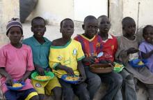 Children displaced as a result of Boko Haram attacks in the northeast region of Nigeria, sit in a row to eat a meal at a camp for internally displaced persons (IDP) in Yola, Adamawa State, January 13, 2015. PHOTO BY REUTERS/Afolabi Sotunde