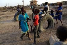 Children play at a railway station camp, where refugees from South Sudan have stayed for four years, in Khartoum, May 11, 2014. PHOTO BY REUTERS/Mohamed Nureldin Abdallah