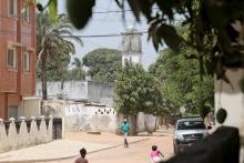 Children walk in front of a Kuwait-funded mosque near the home of a student who left to join the Islamic State in Libya, in Ziguinchor, Senegal, March 3, 2016. PHOTO BY REUTERS/Jean-Francois Huertas