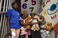 A group of HIV positive children and AIDS orphans at Reach Out Mbuya, a health clinic that does HIV/AIDS community outreach, hold stuffed animals and dolls as U.S. PHOTO BY REUTERS/Jacquelyn Martin