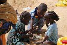 Nigerian children displaced by the Boko Haram insurgence share a meal at a registration centre in Geidam stadium, Nigeria. PHOTO BY REUTERS/Afolabi Sotunde