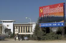 People walk outside a labour camp in Kunming, Yunnan province