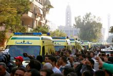 Egyptian Christians shout slogans as ambulances transport the bodies of victims killed in the bombing of Cairo's main Coptic cathedral after the funeral, in Cairo, Egypt, December 12, 2016. PHOTO BY REUTERS/Amr Abdallah Dalsh