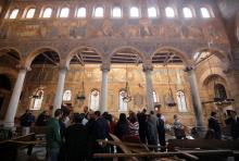 Egyptian security officials and investigators inspect the scene following a bombing inside Cairo's Coptic cathedral in Egypt, December 11, 2016. PHOTO BY REUTERS/Amr Abdallah Dalsh