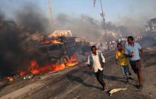 Civilians evacuate from the scene of an explosion in KM4 street in the Hodan district of Mogadishu, Somalia, October 14, 2017. PHOTO BY REUTERS/Feisal Omar