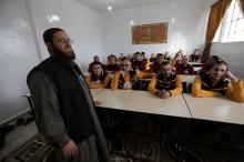 Former Islamic State members sit in a classroom at the Syrian Center for Combating Extremist Ideology in the town of Marea in northern Aleppo countryside, Syria, November 2, 2017. PHOTO BY REUTERS/Khalil Ashawi