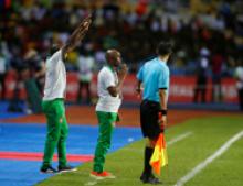 Guinea-Bissau's coach Baciro Cande stands at the sideline. PHOTO BY REUTERS/Mike Hutchings