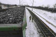 Activists walk along carriages loaded with coal from the occupied territories which they blocked at Kryvyi Torets station in the village of Shcherbivka in Donetsk region, Ukraine, February 14, 2017. PHOTO BY REUTERS/Konstantin Chernichkin