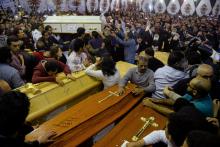 Relatives of victims react to coffins arriving to the Coptic church that was bombed on Sunday in Tanta, Egypt, April 9, 2017. PHOTO BY REUTERS/Mohamed Abd El Ghany