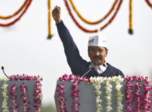 Arvind Kejriwal, leader of Aam Aadmi (Common Man) Party (AAP), shouts slogans after taking the oath as the new chief minister of Delhi during a swearing-in ceremony at Ramlila grounds in New Delhi