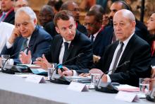 (L-R) U.N. Envoy to Libya, Ghassan Salame, French President Emmanuel Macron and French Foreign Affairs Minister Jean-Yves Le Drian attend an international conference on Libya at the Elysee Palace in Paris, France, May 29, 2018. PHOTO BY REUTERS/Etienne Laurent
