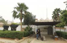 Men stand in front of the Turkish consulate in Benghazi