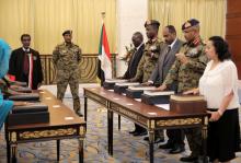 Leader of Sudan's transitional council, Lieutenant General Abdel Fattah Al-Abdelrahman Burhan looks on as military and civilian members of Sudan's new ruling body, the Sovereign Council, are sworn in at the presidential palace in Khartoum, Sudan, August 21, 2019. PHOTO BY REUTERS/Stringer