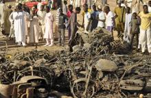 A crowd gathers at a scene of multiple bombings at Kano Central Mosque, November 28, 2014. PHOTO BY REUTERS/Stringer