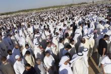 Crowds gather as victims of a bombing at a mosque on Friday, are buried at Al Jafariya cemetery in Suleibikhat, Kuwait, June 27, 2015. PHOTO BY REUTERS/Stringer