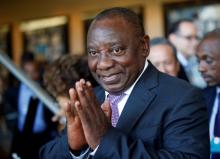 South African Deputy President Cyril Ramaphosa greets security personnel at the World Economic Forum on Africa 2017 meeting in Durban, South Africa, May 5, 2017. PHOTO BY REUTERS/Rogan Ward