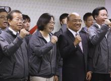 Taiwan's main opposition Democratic Progressive Party (DPP) Chairperson Tsai Ing-wen (2nd L) and party officials celebrate winning the local elections in Taipei, November 29, 2014. PHOTO BY REUTERS/Patrick Lin