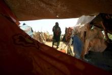 A woman looks on beside a shelter after arriving at the Zam Zam IDP camp, near Al Fashir in North Darfur, April 9, 2015. PHOTO BY REUTERS/Mohamed Nureldin Abdallah