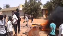 Demonstrators gather at Kalakla Market during a protest against a cut in fuel subsidies in south Khartoum