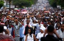 Demonstrators show the Oromo protest gesture sign during Irreecha, the thanks giving festival of the Oromo people in Bishoftu town of Oromia region, Ethiopia, October 2, 2016. PHOTO BY REUTERS/Tiksa Negeri