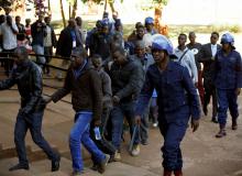 Some of the 16 people detained after police sealed off the building of Opposition Movement for Democratic Change (MDC) on Thursday, appear in court in the capital Harare, Zimbabwe, August 4, 2018. PHOTO BY REUTERS/Philimon Bulawayo