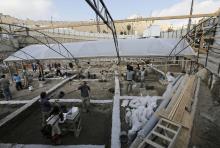 People work in a new dig on the fringes of the archaeological site known as the City of David, situated just outside the Old City in East Jerusalem