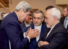 U.S. Secretary of State John Kerry (L) speaks with Hossein Fereydoun (C), the brother of Iranian President Hassan Rouhani, and Iranian Foreign Minister Javad Zarif (R), before the Secretary and Foreign Minister addressed an international press corps gathered at the Austria Center in Vienna, Austria, July 14, 2015. PHOTO BY REUTERS/US State Department