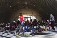 Families displaced by recent fighting in South Sudan, camp in a warehouse inside the United Nations Mission in Sudan (UNAMIS) facility in Jabel, on the outskirts of capital Juba