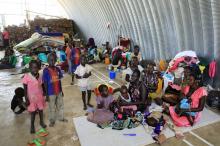 Families displaced by recent fighting in South Sudan, camp in a warehouse inside the United Nations Mission in Sudan (UNAMIS) facility in Jabel, on the outskirts of capital Juba