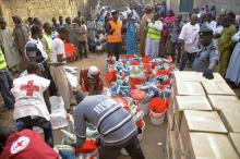 Displaced people gather as the Red Cross in Kano distributes relief materials to displaced victims of the Boko Haram violence, at a relief camp in Dawaki, a local government area in Kano, December 16, 2014. PHOTO BY REUTERS/Stringer