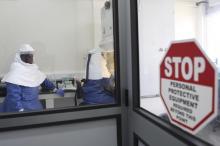 Doctors work in a laboratory on collected samples of the Ebola virus at the Centre for Disease Control in Entebbe, about 37km (23 miles) southwest of Uganda's capital Kampala