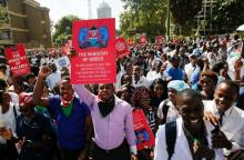 Kenyan doctors carry placards as they chant slogans to demand fulfilment of a 2013 agreement between their union and the government that would raise their pay and improve working conditions outside the employment and labour relations courts in Nairobi, Kenya, January 26, 2017. PHOTO BY REUTERS/Thomas Mukoya