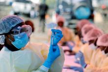 A health worker fills a syringe with Ebola vaccine before injecting it to a patient, in Goma, Democratic Republic of Congo, August 5, 2019. PHOTO BY REUTERS/Baz Ratner