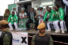 Edgar Lungu (C, in black suit), leader of the Patriotic Front party (PF), dances before addressing his supporters during a rally ahead of Thursday's presidential elections in the capital, Lusaka, Zambia, August 10, 2016. PHOTO BY REUTERS/Jean Serge Mandela