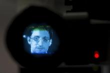 American whistleblower Edward Snowden is seen through a camera viewfinder as he delivers remarks via video link from Moscow to attendees at a discussion regarding an International Treaty on the Right to Privacy, Protection Against Improper Surveillance and Protection of Whistleblowers in Manhattan, New York September 24, 2015. PHOTO BY REUTERS/Andrew Kelly