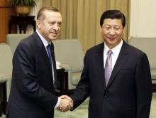 China's Xi Jinping (R) shakes hands with Turkey's Tayyip Erdogan at the Great Hall of the People in Beijing, April 10, 2012. PHOTO BY REUTERS/Kazuhiro Ibuki