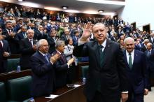 Turkish President Tayyip Erdogan greets members of the parliament from his ruling AK Party during a meeting in Ankara Turkey, March 20, 2018. PHOTO BY REUTERS/Kayhan Ozer/Presidential Palace