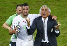 Algeria's Essaid Belkalem (C) celebrates with coach Vahid Halilhodzic