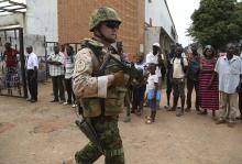 An Estonian soldier from the newly deployed EUFOR-RCA European Union military operation in the Central African Republic, carries his weapon while going on patrol in Bangui